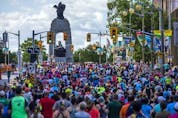 Runners make their way up the hill on Elgin Street, heading north towards the National War Memorial, during the 5K race on Saturday.