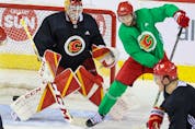  Calgary Flames goaltender Jacob Markstrom and centre Calle Jarnkrok practise at the Scotiabank Saddledome in Calgary on Monday, May 2, 2022.