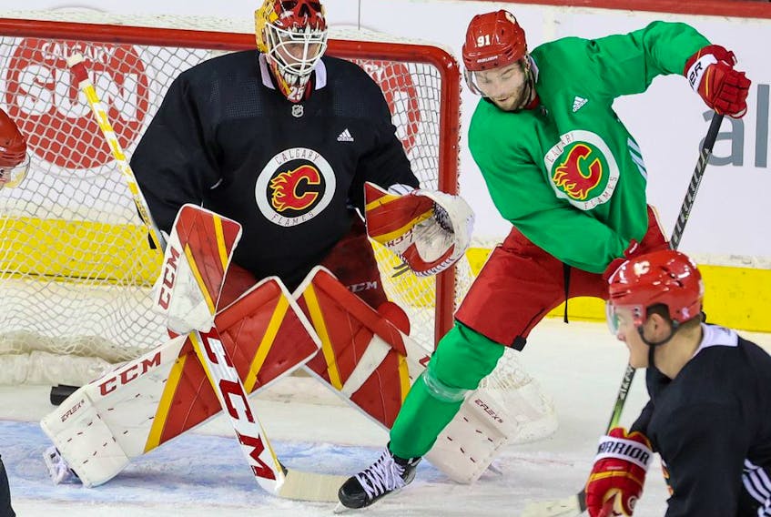  Calgary Flames goaltender Jacob Markstrom and centre Calle Jarnkrok practise at the Scotiabank Saddledome in Calgary on Monday, May 2, 2022.