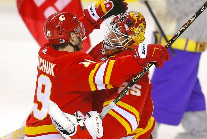 Calgary Flames goaltender Jacob Markstrom is congratulated by Matthew Tkachuk after shutting out the Detroit Red Wings at the Scotiabank Saddledome in Calgary on Saturday, March 12, 2022. 