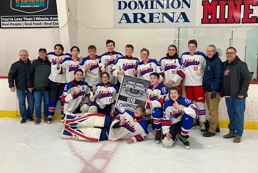 The Cape Breton County Islanders captured the under-18 'C' Charlie Campbell Memorial Hockey Tournament, defeating Western Valley 4-0 in the championship game at the Dominion and District Community Centre last month. Members of the team are shown with the banner. Front row, from left, Andrew Dalzell, Matthew LeBlanc, Bradley MacNeil-Burke, Ethan MacIntyre and Zach Marley. Back row, from left,  Todd MacIntyre (Coach), Bruce Dalzell (Coach), Thomas Prosper, Jesse Holland, Cole MacKenzie, Thomas Morrison, Nathan Trimm, Caelin Allen, Maverick Gould, Rylan MacLellan, Charlie Morrison (Coach) and Trevor LeBlanc (Coach). Missing from the photo was Jacob Hatcher. PHOTO CONTRIBUTED/CHARLIE MORRISON.