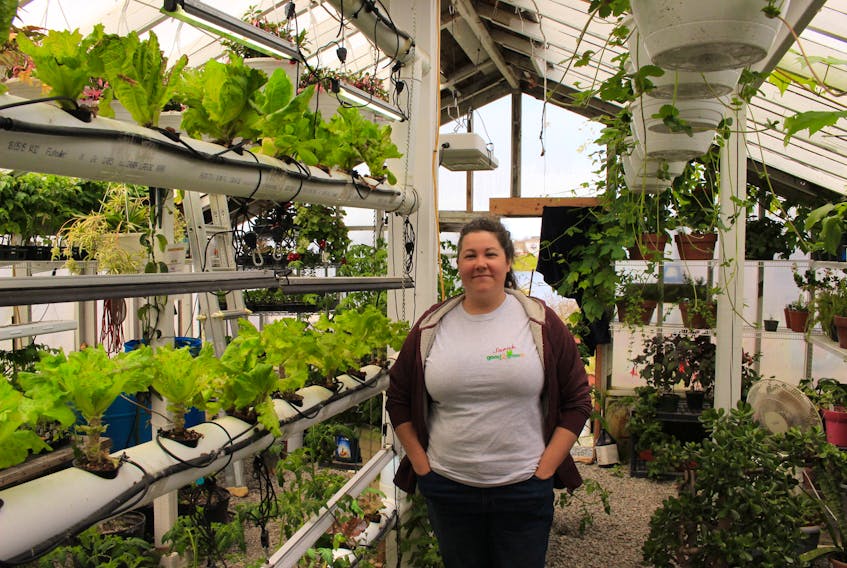 Sarah Pritchett, lead horticulturist at Good2GrowNL stands in the on-site greenhouse. She says there are easy ways to get started with backyard gardening. - Kyle Richards