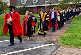 Faculty and members of the graduating class of 2022 at Dalhousie University’s Agricultural Campus depart Jenkins Hall on their way to convocation ceremonies at the athletic centre on Friday, May 27. 