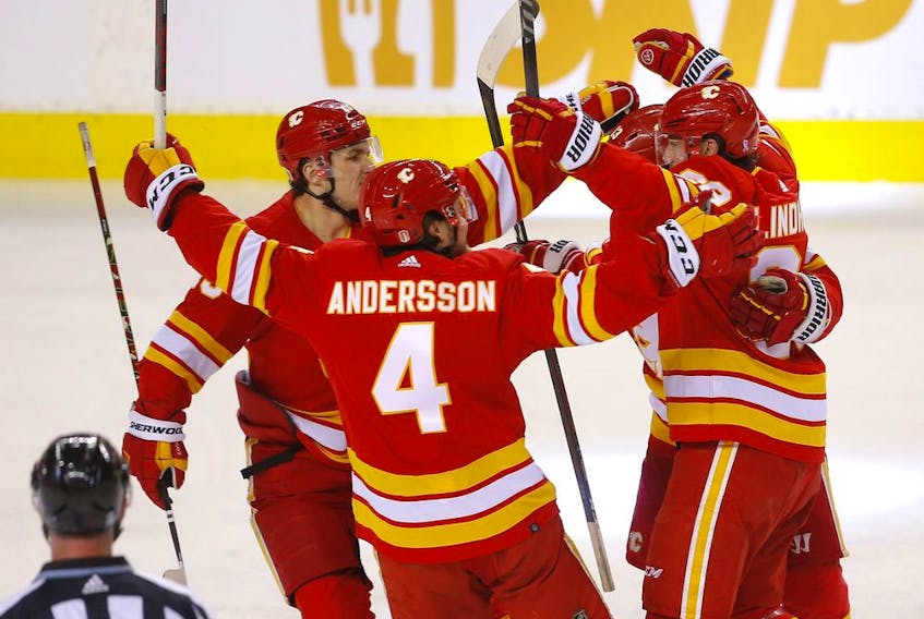 Flames defenceman Rasmus Andersson saw his night end early thanks to a first-period fight-related game misconduct. But he still got to celebrate Elias Lindholm's game-winning goal.