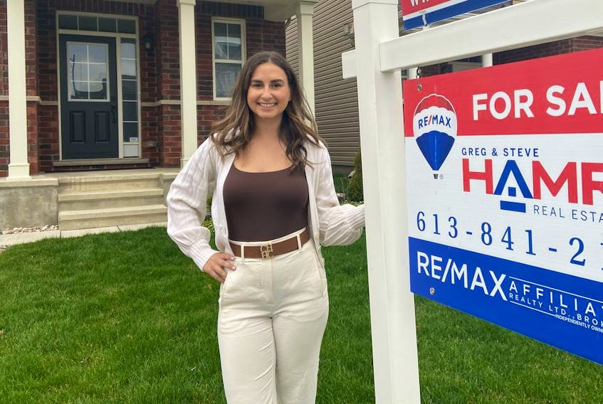 About 40 per cent of the properties sold so far this year by Chelsea Hamre, sales representative with the Hamre Real Estate Team, involved purchases by out-of-towners. Photo credit: Leif Olson.