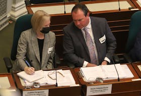 Mark Sidebottom, chief operating officer for Nova Scotia Power, speaks with Judith Ferguson, NSP's vice-president of planning, as he answers a question in front of the legislative committee on public accounts at Province House in Halifax on Wednesday May 4, 2022.

TIM KROCHAK PHOTO
