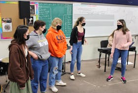 A group of CEC student singers practising 'It's the Hard-Knock Life' from Annie.