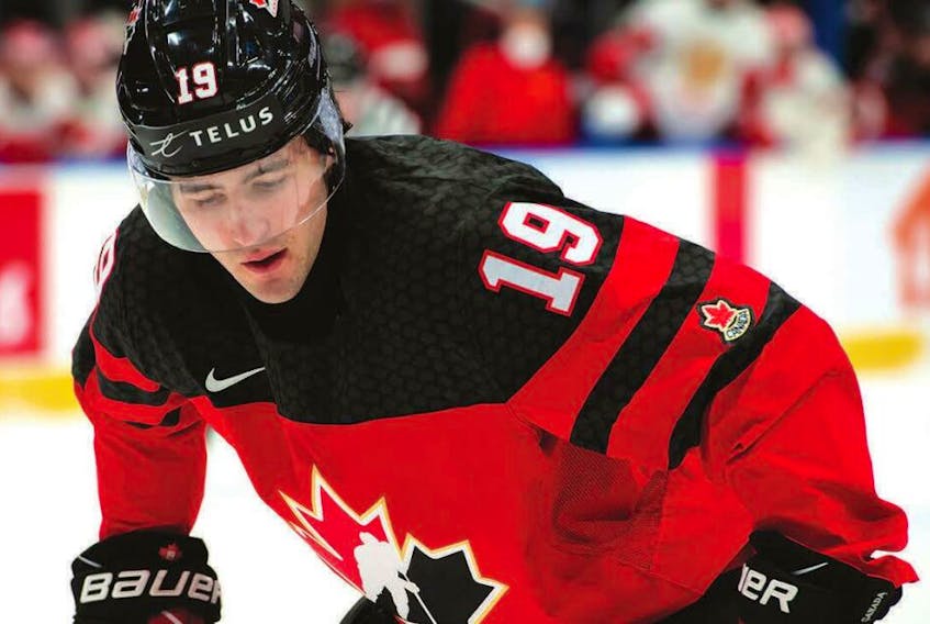 Team Canada centre Elliot Desnoyers prepares for a face-off at the 2022 IIHF World Junior Hockey Championship in Alberta.