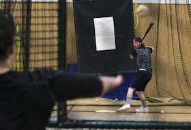 Caleb Medicraft watches a pitch during hitting practice in a batting cage at the Louis Millett Community Complex in New Minas on May 1. The Kentville Wildcats are gearing up for the Nova Scotia Senior Baseball League season with their first game scheduled for May 24 in Halifax against the Halifax Pelham Canadians.
