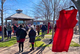 Supporters gather at Confederation Landing Park in Charlottetown in recognition of Red Dress Day. May 5 is the national day of awareness for missing and murdered Indigenous women and girls. The red dresses lining the park are left empty to signify the countless missing women who should be wearing them. Andrew Stetson • Special to The Guardian
