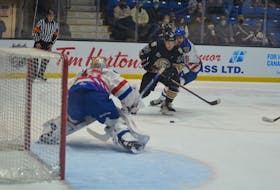 Charlottetown Islanders forward Drew Elliott, 24, looks to get a shot away at Moncton Wildcats goaltender Jonathan Lemieux as he is guarded closely by defenceman Etienne Morin, 5. The action took place during the Islanders’ 7-2 victory in Game 1 of the best-of-five Quebec Major Junior Hockey League playoff series in Charlottetown on May 5. Jason Simmonds • The Guardian