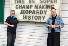 Mattea Roach, right, with her great-aunt Carol Church by the sign of support for the 23-day Jeopardy! champion on May 6. The sign is on the side of Church's ValueMart in Marion Bridge.  Mattea Roach, right, with her great-aunt Carol Church by the sign of support for the 23-day Jeopardy! champion on May 6. The sign is on the side of Church's ValueMart in Marion Bridge. CONTRIBUTED