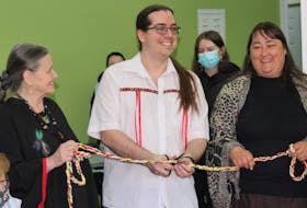 Delina Petit Pas, left, executive director of the Mi'kmaw Heritage Research and Restoration Association, Shane Snook, project manager of the Pi'tawa'si Language Centre, and St. George’s Indian Band Chief Rhonda Sheppard cut a ribbon to officially open centre in St. George’s on April 30.
