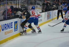 Charlottetown Islanders forward Zachary Roy, 8, and the Moncton Wildcats’ Francesco Iasenza, 6, compete for the puck in Game 1 of the best-of-five Quebec Major Junior Hockey League playoff series at Eastlink Centre on May 5. Roy opened the scoring 10 seconds into the game, and the Islanders went on to post a 7-2 victory. Jason Simmonds/The Guardian