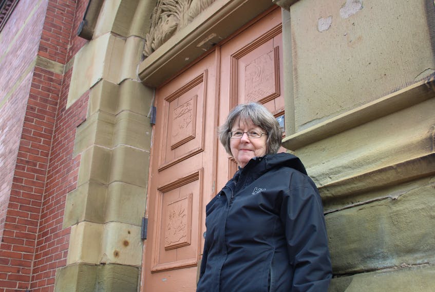 Jean MacKay, an archivist and curatorial assistant at the MacNaught History Centre and Archives in Summerside, is looking to set the record straight on a 130-year-old mystery surrounding a stone carving of a pig on Summerside City Hall.