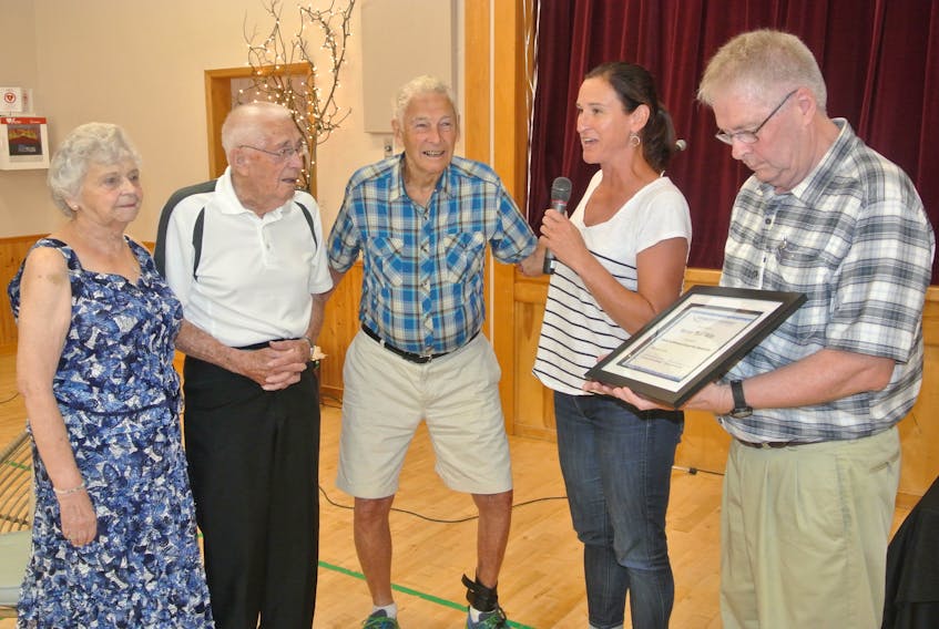 Leslie Wilson, general manager of Ski Wentworth, speaks during the 100th birthday party for Wyman ‘Bun’ Betts (second from left) at the Wentworth Community Centre in 2019. Betts passed away April 30 at age 102.  File