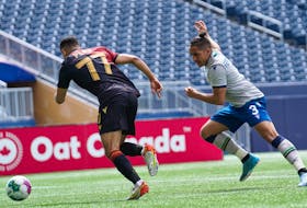 HFX Wanderers midfielder Zachary Fernandez chases defender Federico Pena of Valour FC during Canadian Premier League action Saturday afternoon at IG Field in Winnipeg. The Wanderers and Valour played to a 0-0 draw. - CANADIAN PREMIER LEAGUE