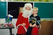 Blake Coleman, decked out in a Dallas Stars jersey, sits on Santa’s knee in 1995. (Courtesy of Coleman family)