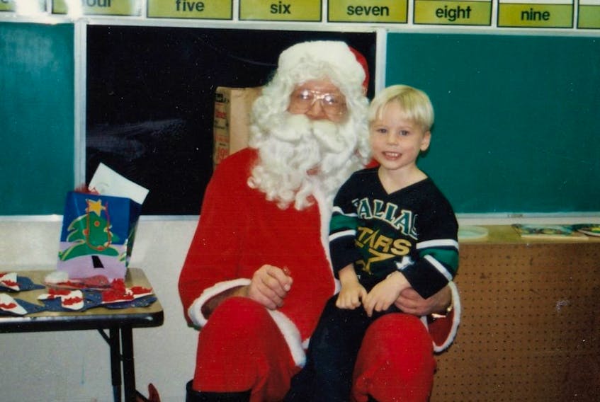  Blake Coleman, decked out in a Dallas Stars jersey, sits on Santa’s knee in 1995. (Courtesy of Coleman family)