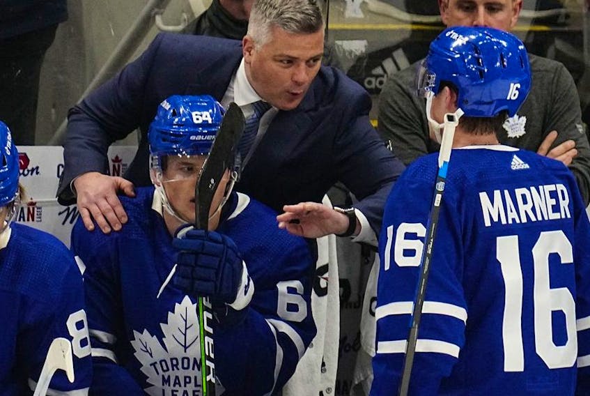 May 2, 2022; Toronto, Ontario, CAN; Toronto Maple Leafs head coach Sheldon Keefe congratulates forward Mitchell Marner (16) and forward David Kampf (64) after his goal against the Tampa Bay Lightning during the second period of game one of the first round of the 2022 Stanley Cup Playoffs at Scotiabank Arena. 