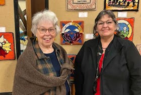 P.E.I. visual artist Noella Moore, right, was one of five Indigenous artists who provided designs for the Every Child Matters project organized by the Rug Hooking Guild of Nova Scotia. An exhibition of the 66 hooked mats was officially opened by guild president Ann Jones in Halifax on May 4. Ann’s interpretation of Noella’s design is shown top centre.