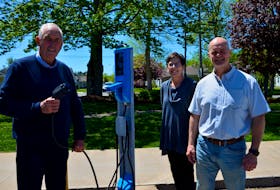 Berwick Mayor Don Clarke, Berwick Electric Commission billing clerk Janet Small and chief administrative officer Michael Payne with the electric vehicle charging station installed outside of town hall. KIRK STARRATT