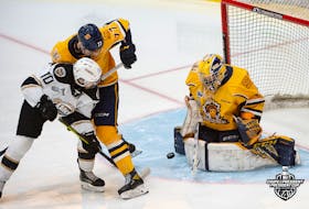 Charlottetown Islanders forward and team captain Brett Budgell attempts to redirect a shot past Shawinigan Cataractes goaltender Antoine Coulombe during Game 4 in the best-of-seven Quebec Major Junior Hockey League’s President Cup final on June 9. The Islanders won the game 7-0 to cut Shawinigan’s series lead to 3-1. The Islanders host Game 5 at Eastlink Centre on June 11 at 5 p.m. Ghyslain Bergeron/QMJHL