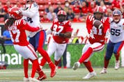  Calgary Stampeders defensive back Dionte Ruffin comes short of the interception only to have defensive lineman Mike Rose get it against the Montreal Alouettes on Thursday.