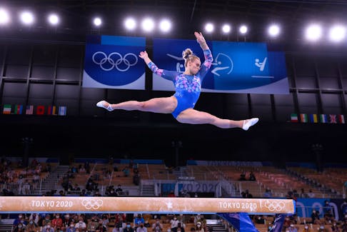 Elsabeth Black of Canada in action on the balance beam at the 2020 Tokyo Olympics. Gymnasts are among the wave of amateur athletes trying to ensure safer participation in their sport.