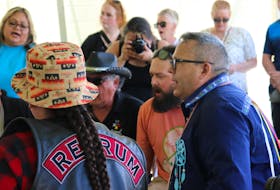 Junior Gould, right, chief of Abegweit First Nation, helps lead the Mi’kmaq Honour Song at a powwow in the Scotchfort Reserve on June 11. - Logan MacLean • The Guardian