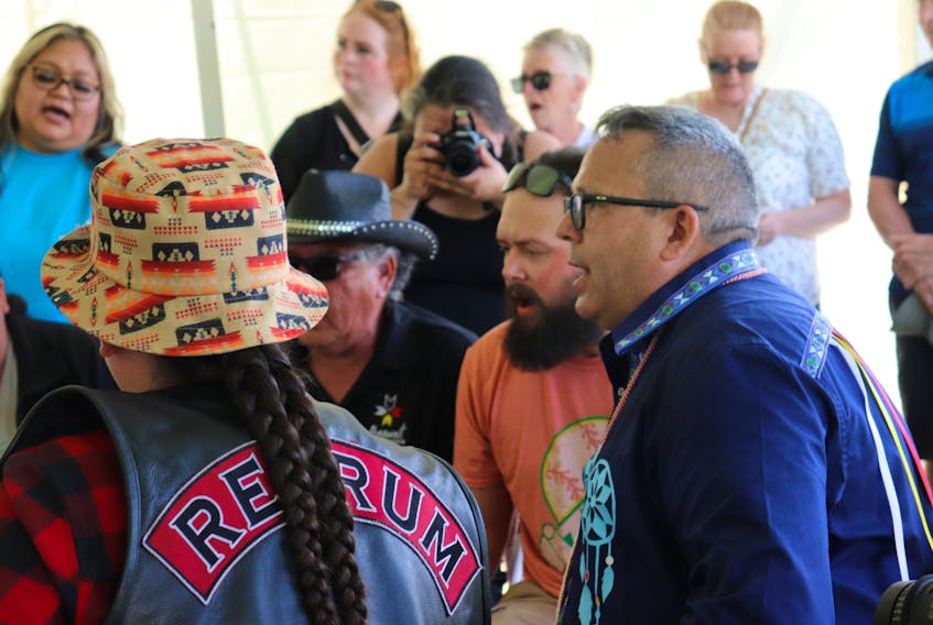 Junior Gould, right, chief of Abegweit First Nation, helps lead the Mi’kmaq Honour Song at a powwow in the Scotchfort Reserve on June 11. - Logan MacLean • The Guardian