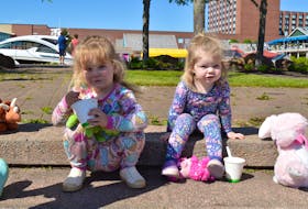 Sisters Annie Bevan, 3, and Millie Bevan, 2, enjoy some ice cream at the Ronald McDonald House PJ Walk for Kids June 12 at Confederation Landing Park in Charlottetown. Participants in the sixth annual fundraiser enjoyed sunshine and warm temperatures – as well as the chance to wear their pyjamas outside. Bouncy castles, a pink firetruck and a teddy bear clinic made for a fun family outing to support a good cause. The Ronald McDonald House on Tower Road in Halifax, N.S., hosted 70 P.E.I. families for a total of 550 nights last year, saving them $272 per night said CEO Lori Barker, who had donned her PJs for the occasion. Accommodations at Ronald McDonald House are available for families taking children 18 or under for medical appointments in the area. Any family, regardless of their child’s medical condition, household income or length of stay, is welcomed to stay with them, said Barker. - Alison Jenkins • The Guardian