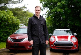 Cameron Vihant, with two of his vehicles he provides through the Turo car-sharing service, in the driveway of his Halifax home Tuesday.
TIM KROCHAK PHOTO