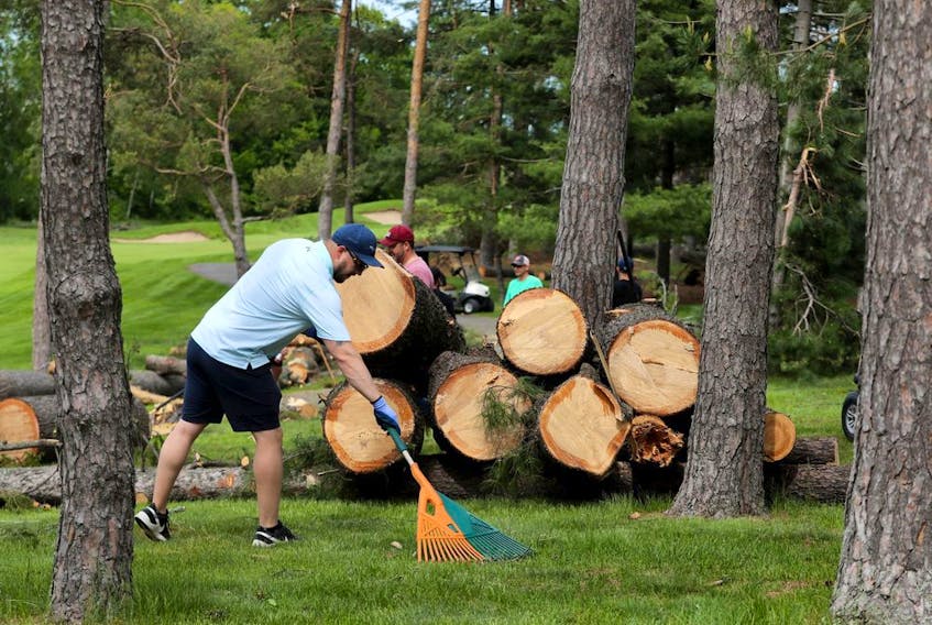 Crews are seen cleaning up the  Ottawa Hunt and Golf Club on Wednesday, May 25, 2022.