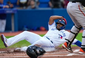 Toronto Blue Jays first baseman Vladimir Guerrero Jr. (27) is safe at home during first inning American League MLB baseball action against the Baltimore Orioles in Toronto on Wednesday, June 15, 2022.
