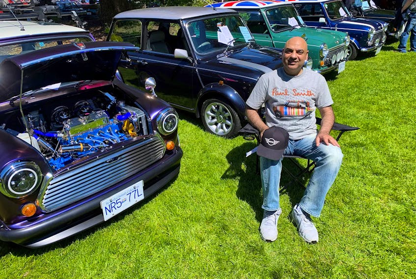 Nadir Ibadullah poses with his collection of classic Mini cars on display at Vancouver’s All-British Field Meet. Alyn Edwards photo