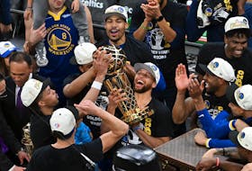 Golden State Warriors guard Stephen Curry (30) holds up the Larry O'Brien Trophy after defeating the Boston Celtics in game six of the 2022 NBA Finals at TD Garden in Boston on Thursday, June 16, 2022. - Bob DeChiara / USA TODAY Sports