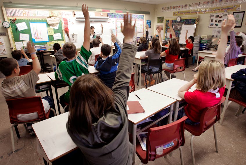 May 24, 2006--Students put up their hands during Ruby Gosse's Grade 6 class at Fairview Heights Elementary in Halifax Wednesday.
(to go with story on reduction of classroom sizes)