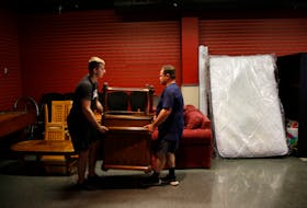 FOR NEWS STORY:
Ukrainian refugees move furniture in what wil be  donation centre for them in Halifax June 15, 2022.