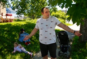 FOR NEWS STORY:
Dmytro Zveryev
Tetiana - wife,(not in photo) and two daughters
Elyzaveta 10, and Kateryna, 2, in front of their temproary apartment in north-end Dartmouth....seen as they were just beginning to move in, Thursday June 16, 2022.. Dima was brifly emotional saying they were starting all over again.

TIM KROCHAK PHOTO