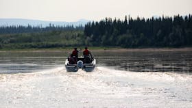 First Nations Guardians in Edéhzhíe Dehcho Protected Area, in the Northwest Territories, patrol by motor boat. — Contributed photo