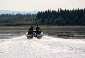 First Nations Guardians in Edéhzhíe Dehcho Protected Area, in the Northwest Territories, patrol by motor boat. — Contributed photo