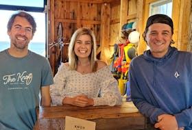 Sean and Caley Aylward, left and centre, with their friend Keith Parker at their newest venture, The Knot Beach Bar & Rentals. The business is a new bar on the Summerside waterfront which also does bike, kayak and paddleboard rentals. Colin MacLean - Journal Pioneer
