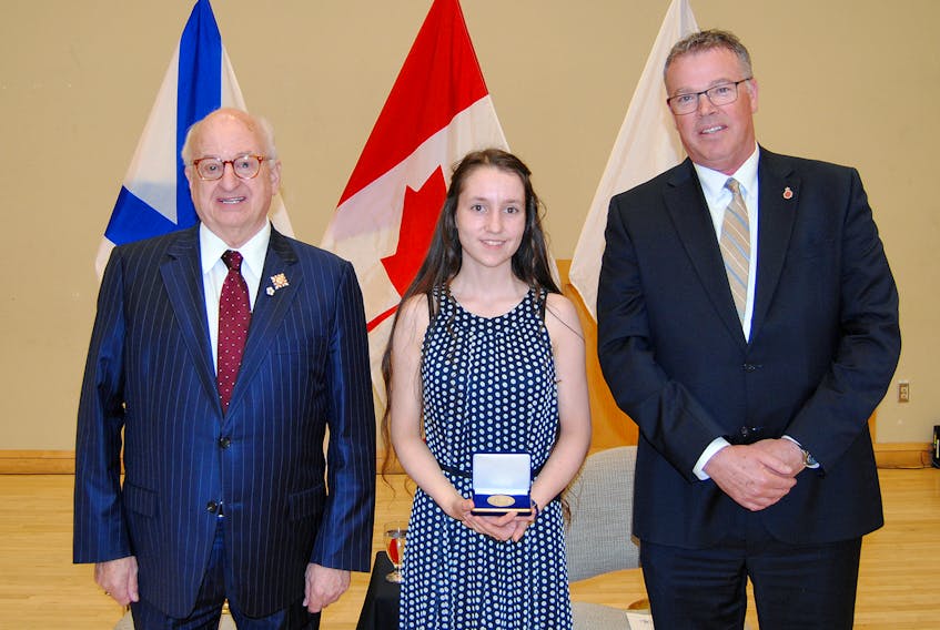 Grade 11 student Rachelle Black, centre, is one of two Lieutenant Governor Education Medal recipients from Baddeck Academy for spring 2022. On the honour roll since middle school, Black is also a contributor to the school newspaper, a school breakfast program co-ordinator from 2018-2021 and a volunteer at a local barn for retired racehorses. She is seen during a ceremony in Port Hawkesbury on May 31 with Lt.-Gov. Arthur J. LeBlanc, Lieutenant Governor of Nova Scotia, left, and Paul Landry, regional executive director for the Strait Regional Centre for Education. CONTRIBUTED/LIEUTENANT GOVERNOR'S OFFICE