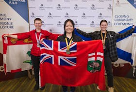 Jillian Clark of P.E.I., left, Vy Le of Manitoba and Olivia Sewell of Nova Scotia during the 2022 Skills Canada national competition in Vancouver, B.C. Clark won silver for Cooking at the competition.