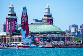Canada SailGP team, helmed by Phil Robertson, sails past spectators on Navy Pier during Saturday's races of the T-Mobile United States Sail Grand Prix in Chicago. The Canada SailGP team features two Nova Scotians in its crew. - BOB MARTIN / SAILGP