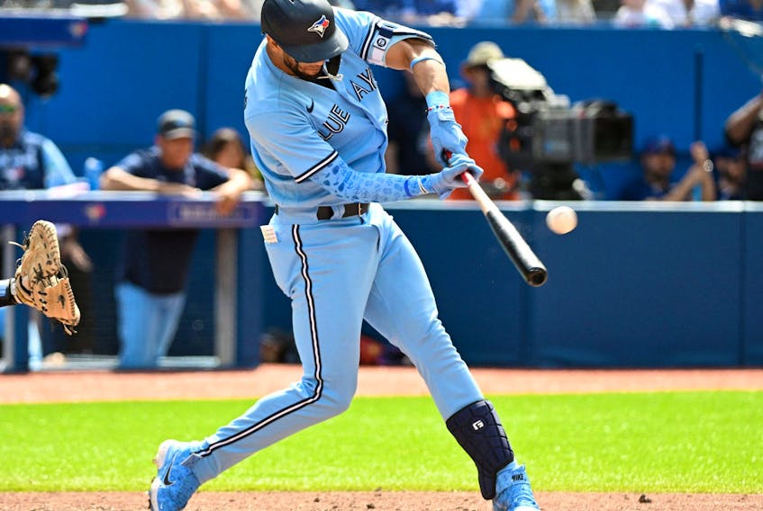 Toronto Blue Jays left fielder Lourdes Gurriel Jr. hits a grand slam home run against the New York Yankees in the sixth inning at Rogers Centre on June 19, 2022 in Toronto.