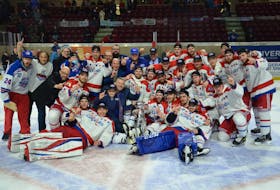 General manager Pat McIver, back row, blue hat, poses with the Summerside D. Alex MacDonald Ford Western Capitals after the team won the 2021-22 Maritime Junior Hockey League (MHL) championship on home ice in early May. The Caps were named the MHL’s 2021-22 executive of the year recently. Jason Simmonds • The Guardian