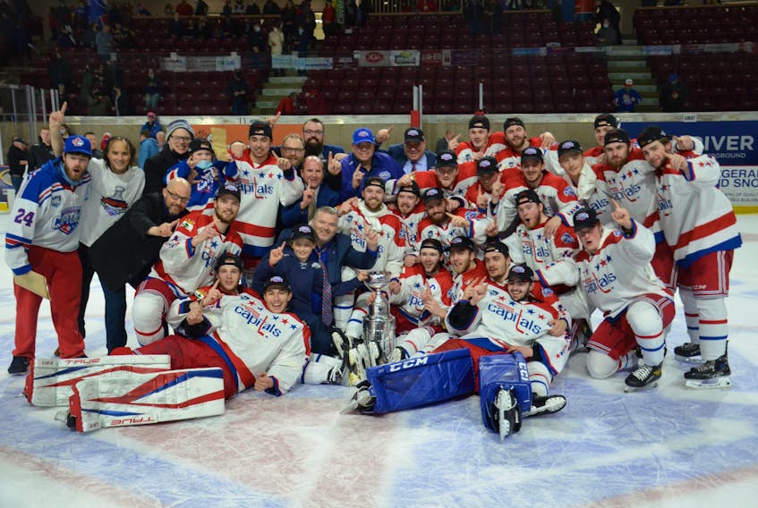 General manager Pat McIver, back row, blue hat, poses with the Summerside D. Alex MacDonald Ford Western Capitals after the team won the 2021-22 Maritime Junior Hockey League (MHL) championship on home ice in early May. The Caps were named the MHL’s 2021-22 executive of the year recently. Jason Simmonds • The Guardian