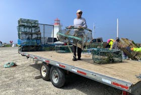 Local fisherman Wade Ross carries a beat up lobster trap collected from the shoreline in Baccaro Point to be stacked on a trailer and taken to the local C&D Landfill. The one day shoreline cleanup netted 18,100 pounds of debris consisting of  approximately 1,000 pounds of plastics and rope and over 350 broken and damaged lobster traps that had washed ashore. KATHY JOHNSON